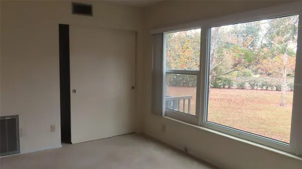 a view of an empty room with a window