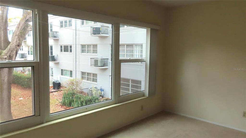 2295 Americus Boulevard East, Unit 29 Clearwater, FL 33763 - Photo 25 of 39 a view of an empty room with a window