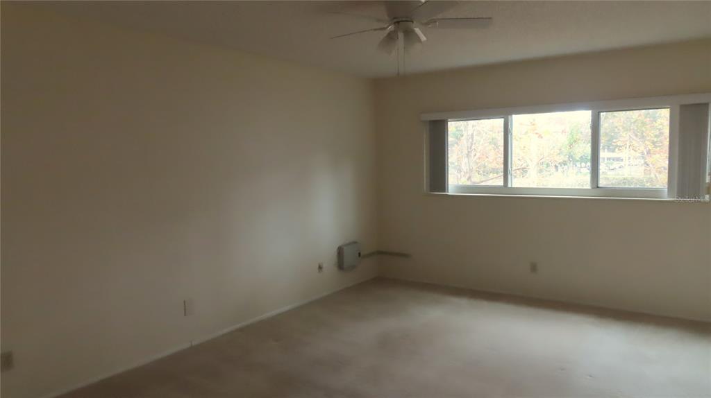 2295 Americus Boulevard East, Unit 29 Clearwater, FL 33763 - Photo 26 of 39 an empty room with a window