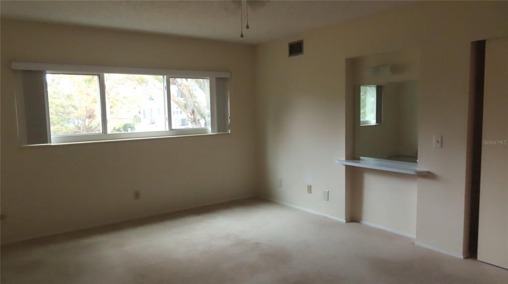 2295 Americus Boulevard East, Unit 29 Clearwater, FL 33763 - Photo 27 of 39 an empty room with a window