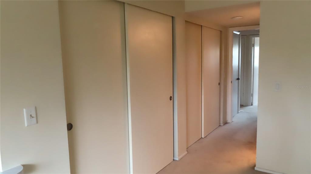 2295 Americus Boulevard East, Unit 29 Clearwater, FL 33763 - Photo 29 of 39 a view of a hallway with closet area