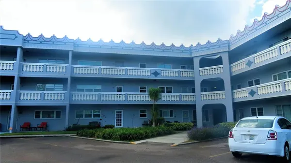 a front view of a building with many windows