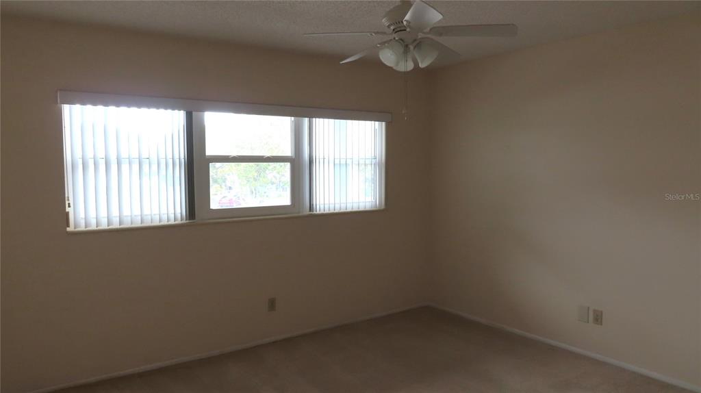 2295 Americus Boulevard East, Unit 29 Clearwater, FL 33763 - Photo 32 of 39 an empty room with a window