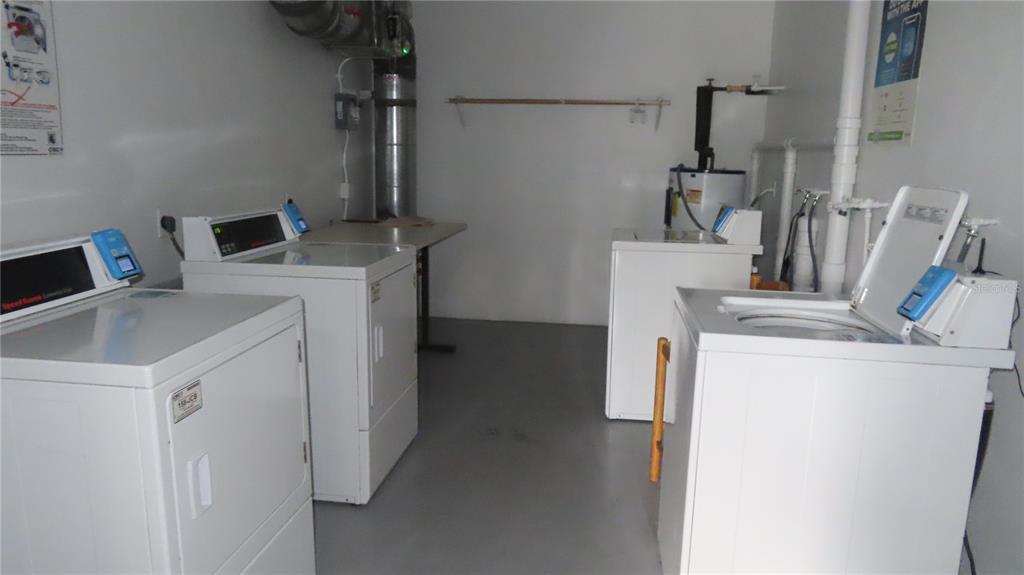 2295 Americus Boulevard East, Unit 29 Clearwater, FL 33763 - Photo 39 of 39 a utility room with dryer and washer