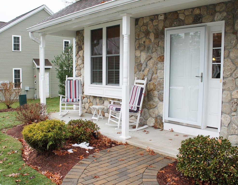 53 Baldwin Road, Unit 1501 Billerica, MA 01821 - Photo 2 of 22 front view of a house with a bench