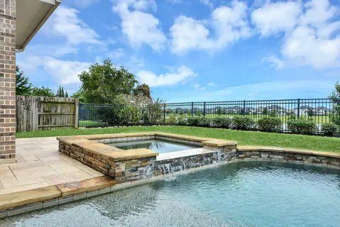 a view of outdoor space swimming pool and yard