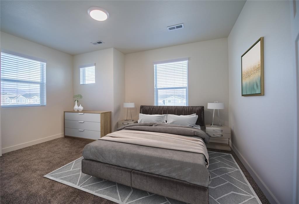 12603 Telge Road, Unit 7D Cypress, TX 77429 - Photo 9 of 19 a bedroom with a bed and a window