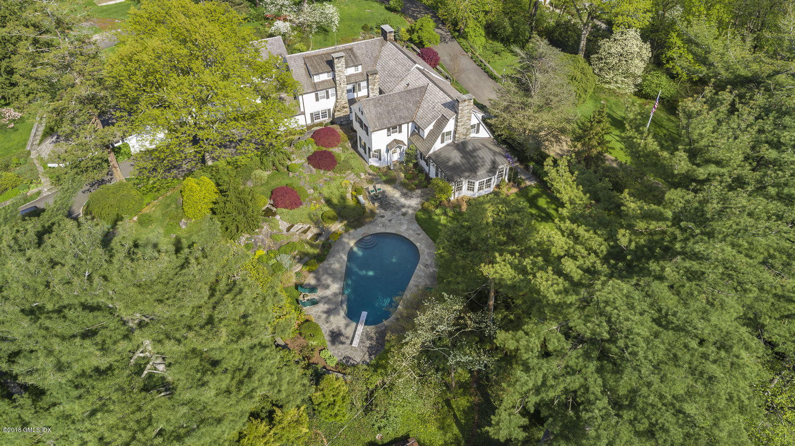 32 Pecksland Road Greenwich, CT 06831 - Photo 14 of 24 a aerial view of a house with a yard and large trees