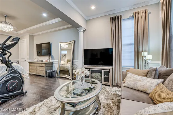 a bedroom with a bed and a television