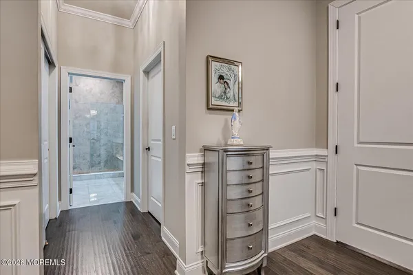 a bedroom with bed and a chandelier