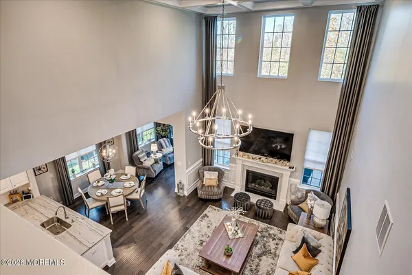 a view of a livingroom with furniture and a window