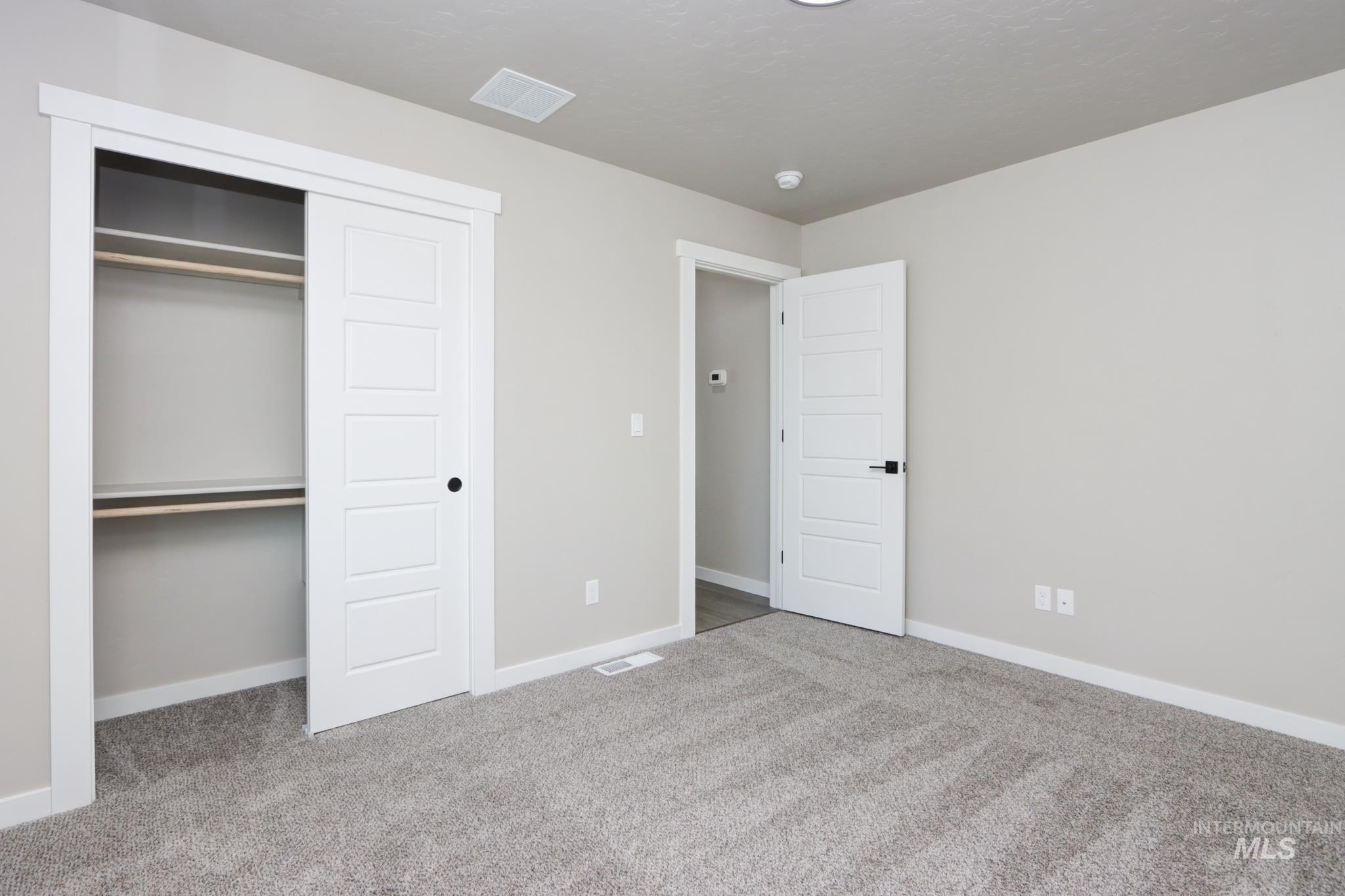 848 North 5th Street Nyssa, OR 97913 - Photo 34 of 49 Plush gray carpet flooring, white trim, and light gray wall paint