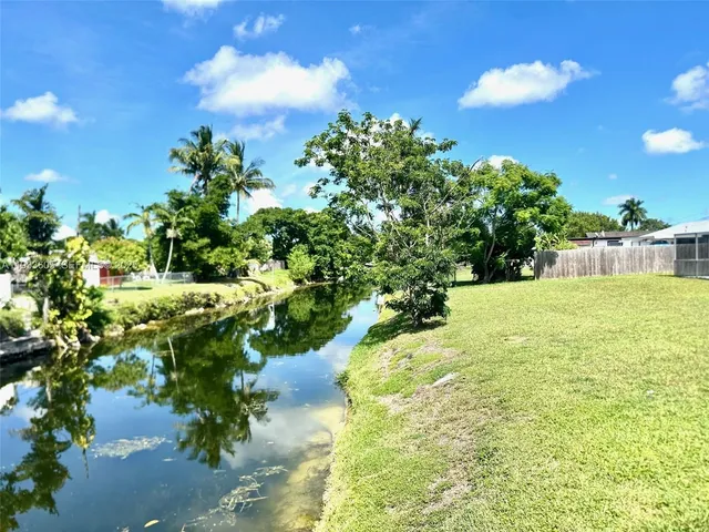 a view of a garden with a fountain