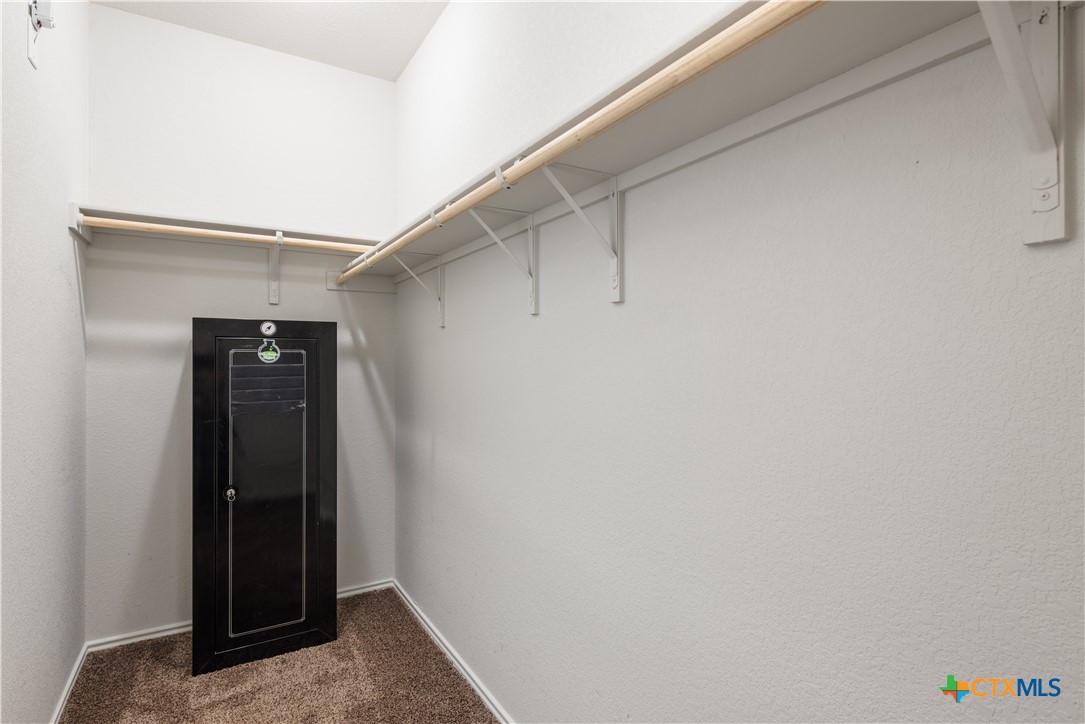 1129 Ibis Falls Loop Jarrell, TX 76537 - Photo 13 of 39 a view of walk in closet