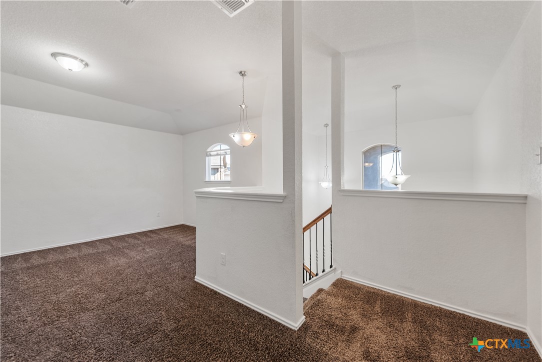 1129 Ibis Falls Loop Jarrell, TX 76537 - Photo 26 of 39 an empty room with windows