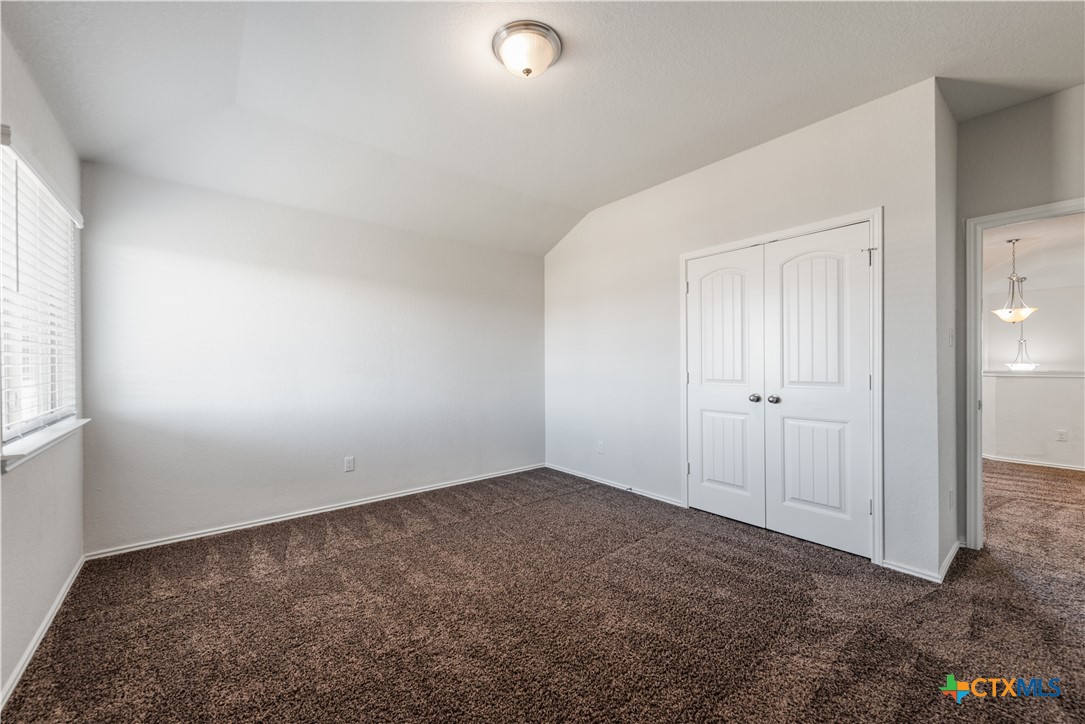 1129 Ibis Falls Loop Jarrell, TX 76537 - Photo 27 of 39 an empty room with windows