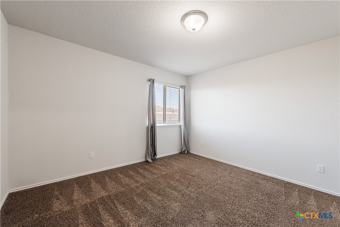 1129 Ibis Falls Loop Jarrell, TX 76537 - Photo 28 of 39 an empty room with a empty space and window