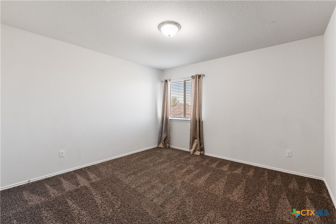 1129 Ibis Falls Loop Jarrell, TX 76537 - Photo 29 of 39 an empty room with a empty space and windows