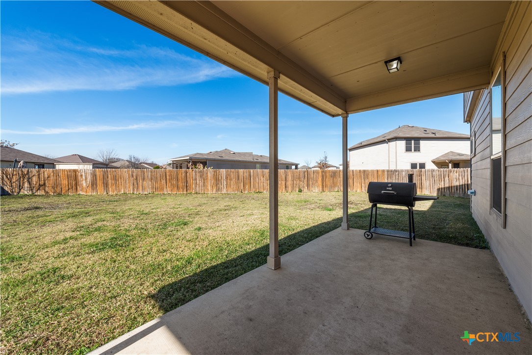 1129 Ibis Falls Loop Jarrell, TX 76537 - Photo 33 of 39 a view of an chairs and table in patio