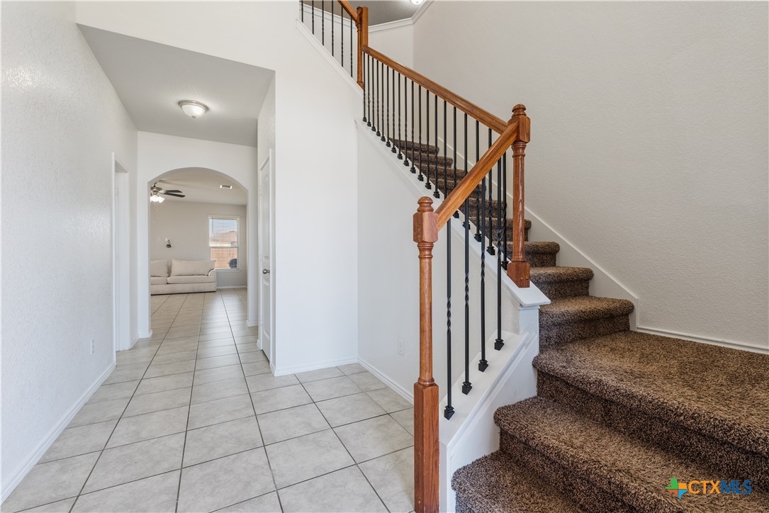 1129 Ibis Falls Loop Jarrell, TX 76537 - Photo 5 of 39 a view of a hallway view with staircase