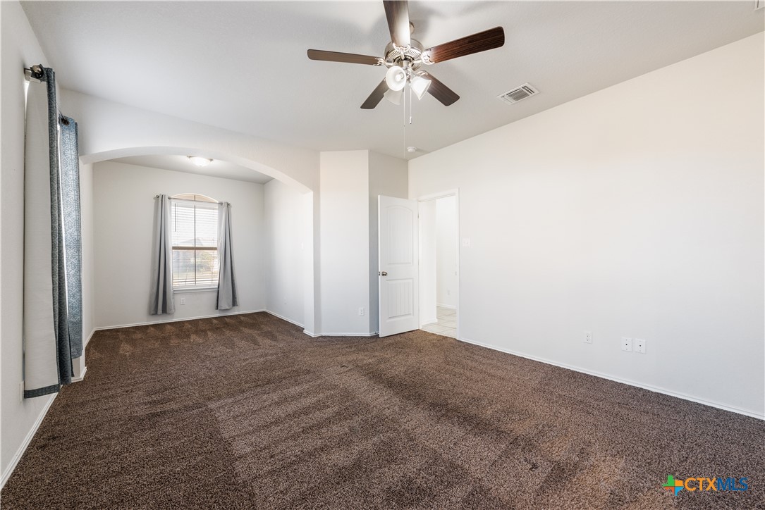 1129 Ibis Falls Loop Jarrell, TX 76537 - Photo 9 of 39 a view of empty room with window and ceiling fan