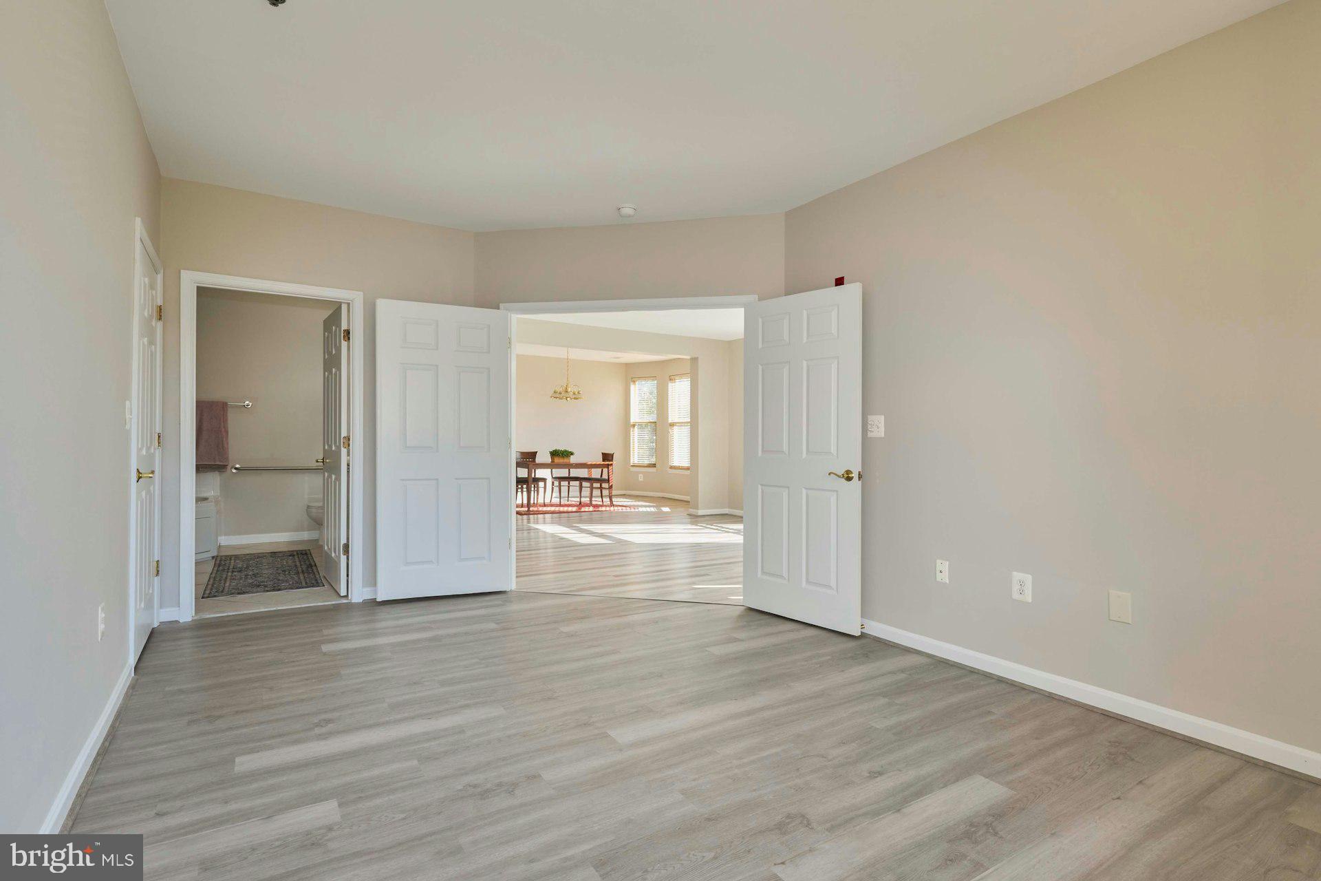 1851 Stratford Park Place, Unit 212 Reston, VA 20190 - Photo 19 of 40 a view of a room with wooden floor