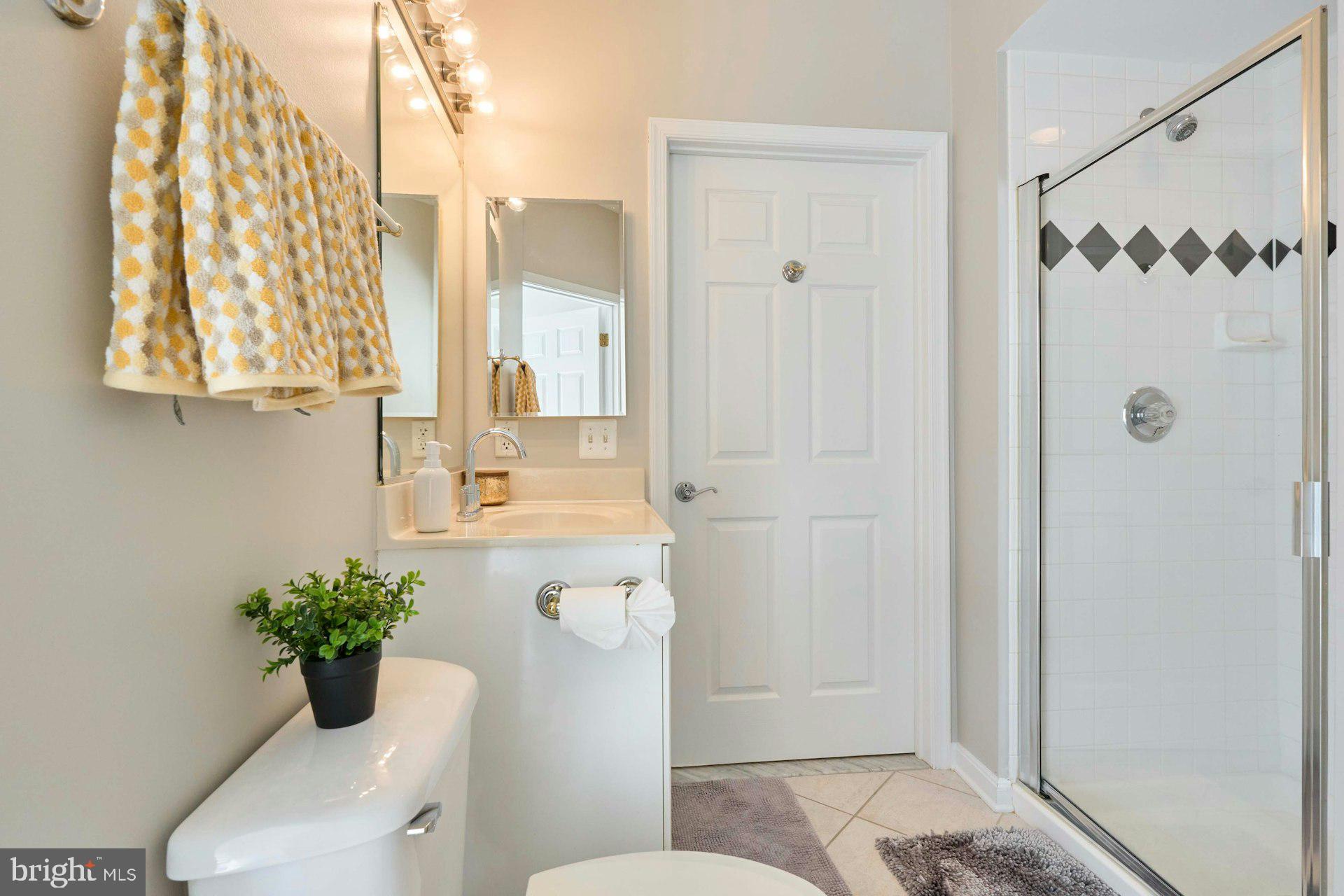 1851 Stratford Park Place, Unit 212 Reston, VA 20190 - Photo 25 of 40 a bathroom with a toilet shower and a sink