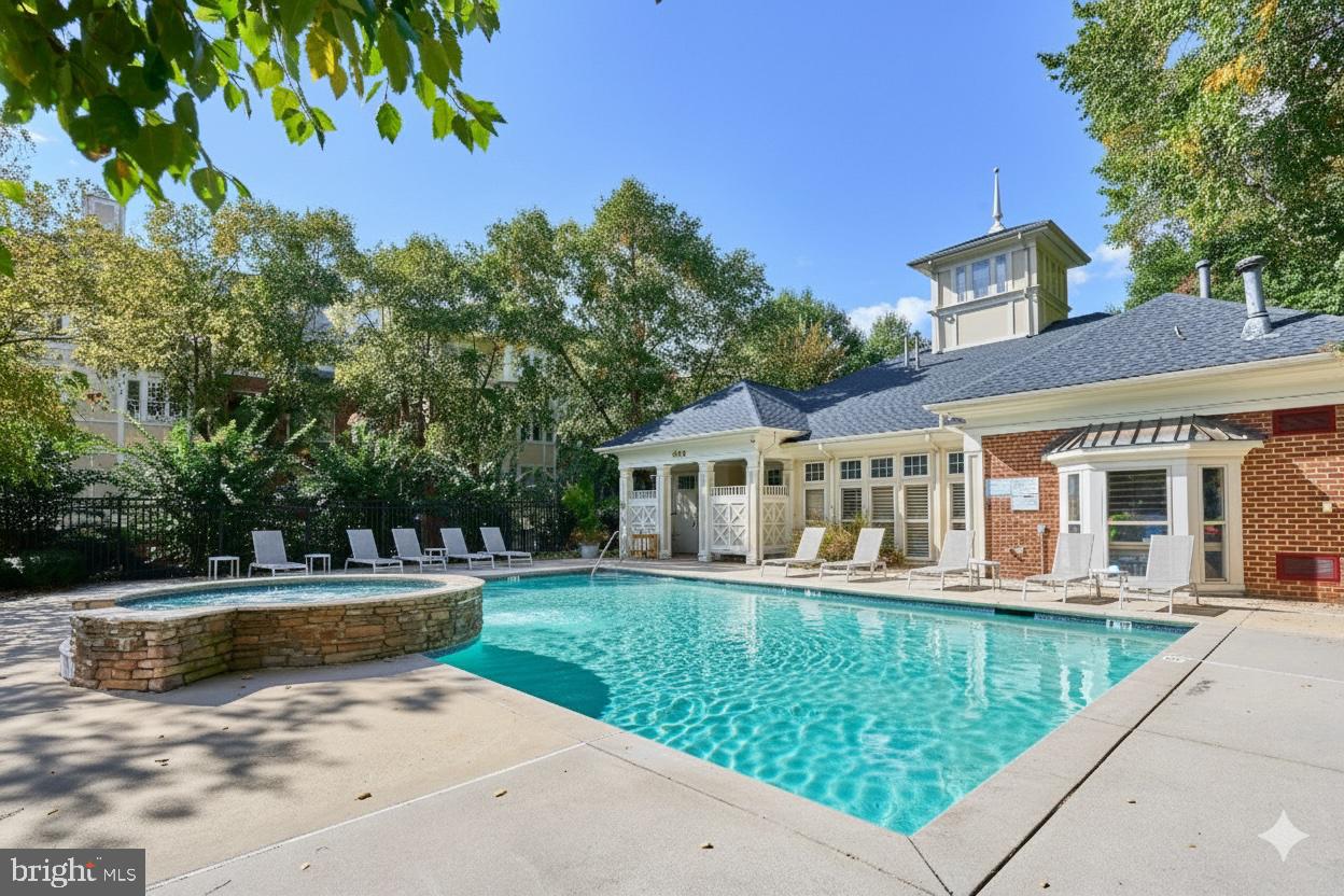 1851 Stratford Park Place, Unit 212 Reston, VA 20190 - Photo 25 of 39 front view of a house with a yard