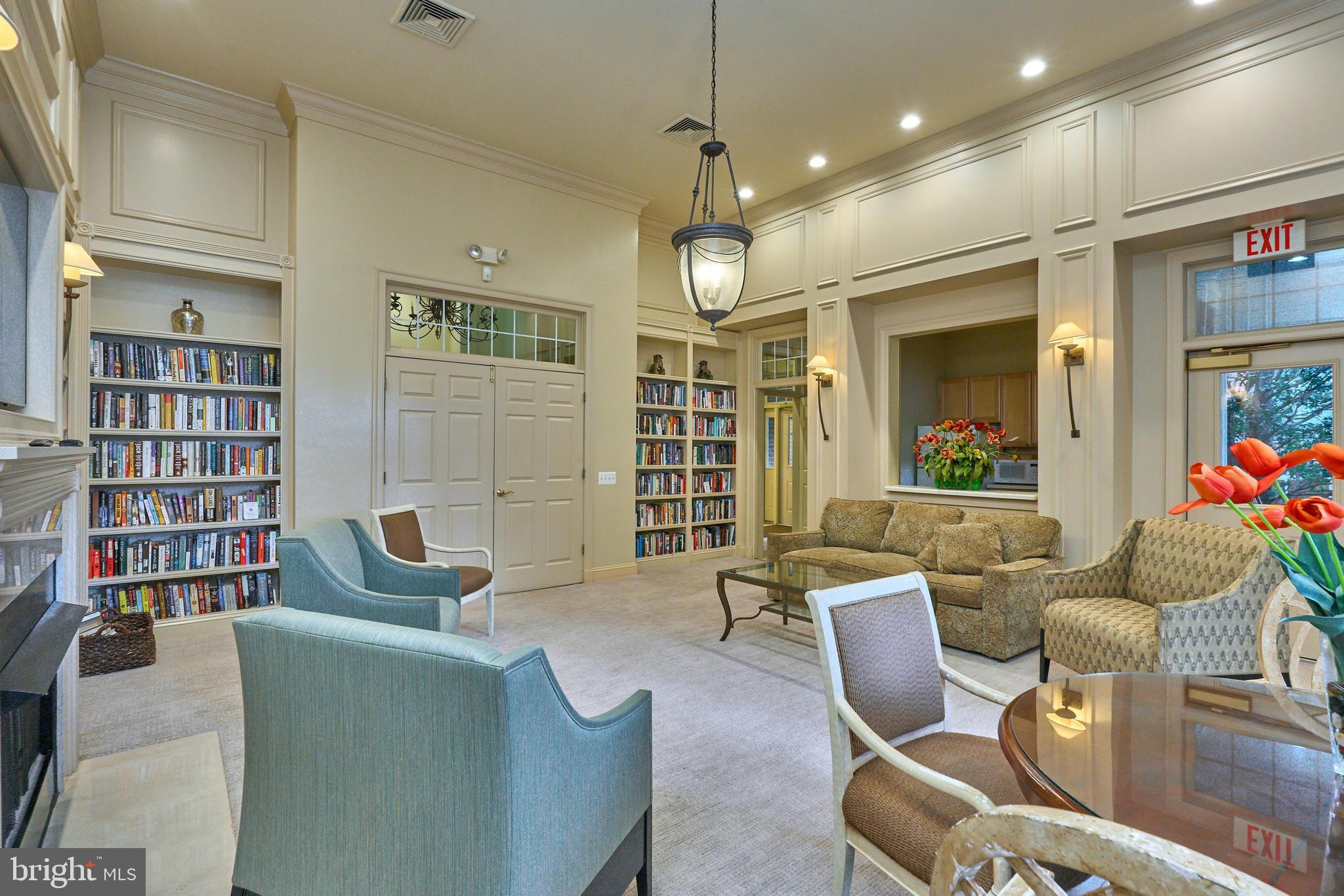 1851 Stratford Park Place, Unit 212 Reston, VA 20190 - Photo 28 of 40 a living room with furniture and a large window