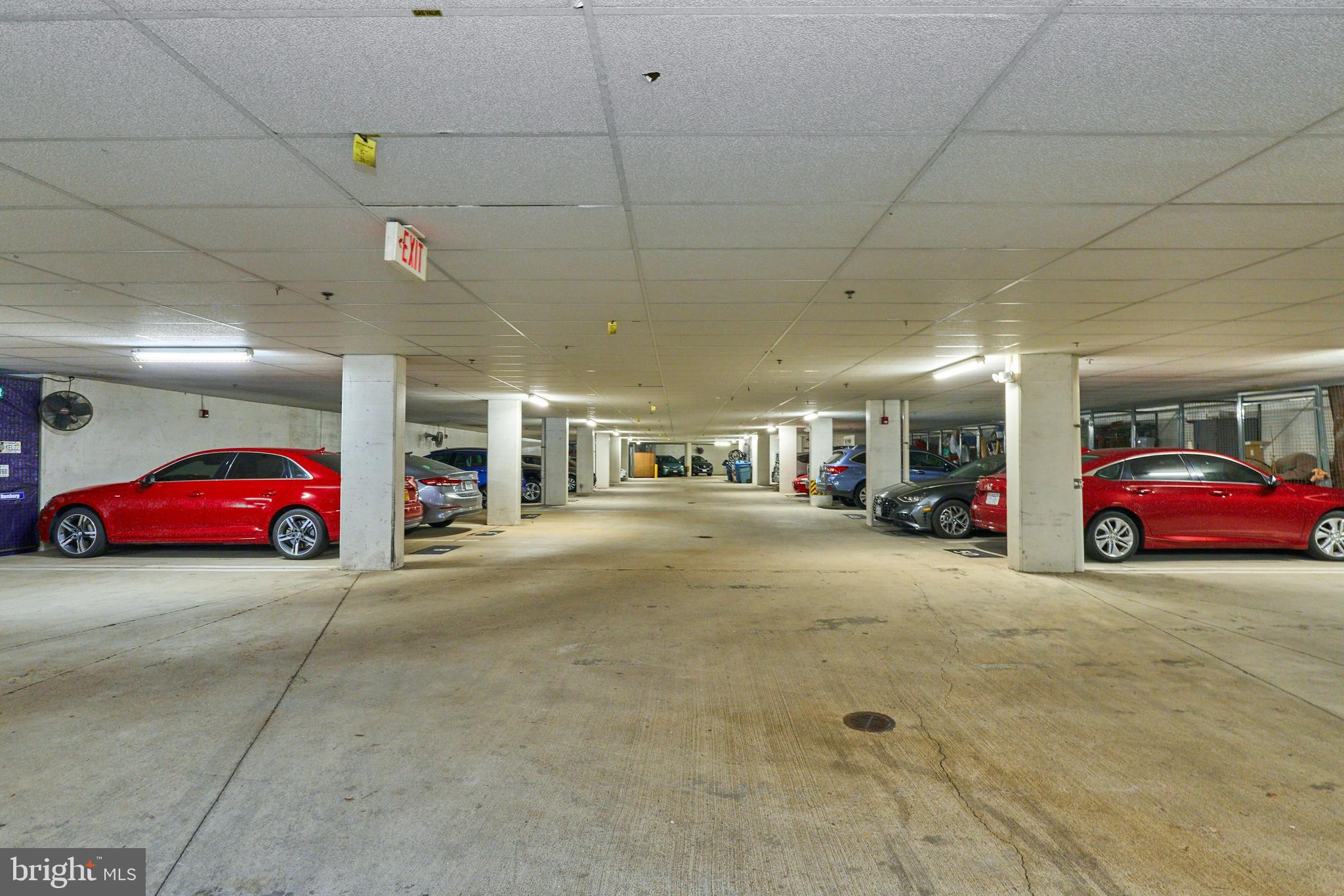 1851 Stratford Park Place, Unit 212 Reston, VA 20190 - Photo 38 of 40 a view of a cars park in front of a building