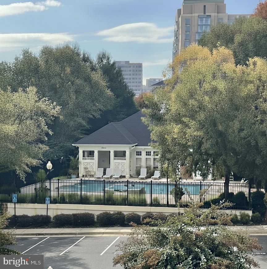 1851 Stratford Park Place, Unit 212 Reston, VA 20190 - Photo 39 of 40 a front view of a house with a yard