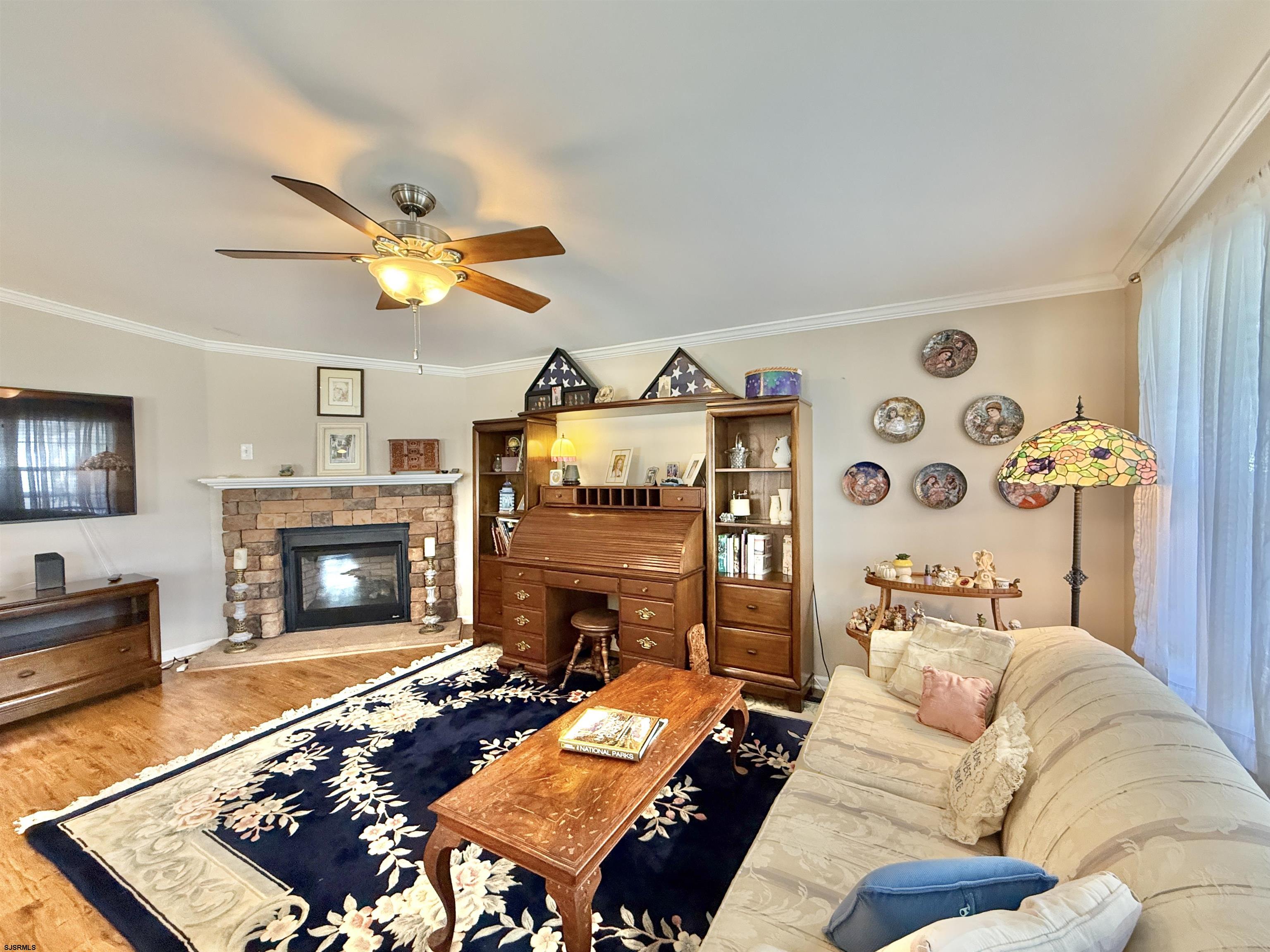 2058 South Shore Rd (route 9) Ocean View, NJ 08230 - Photo 13 of 36 a living room with furniture a fireplace and a flat screen tv
