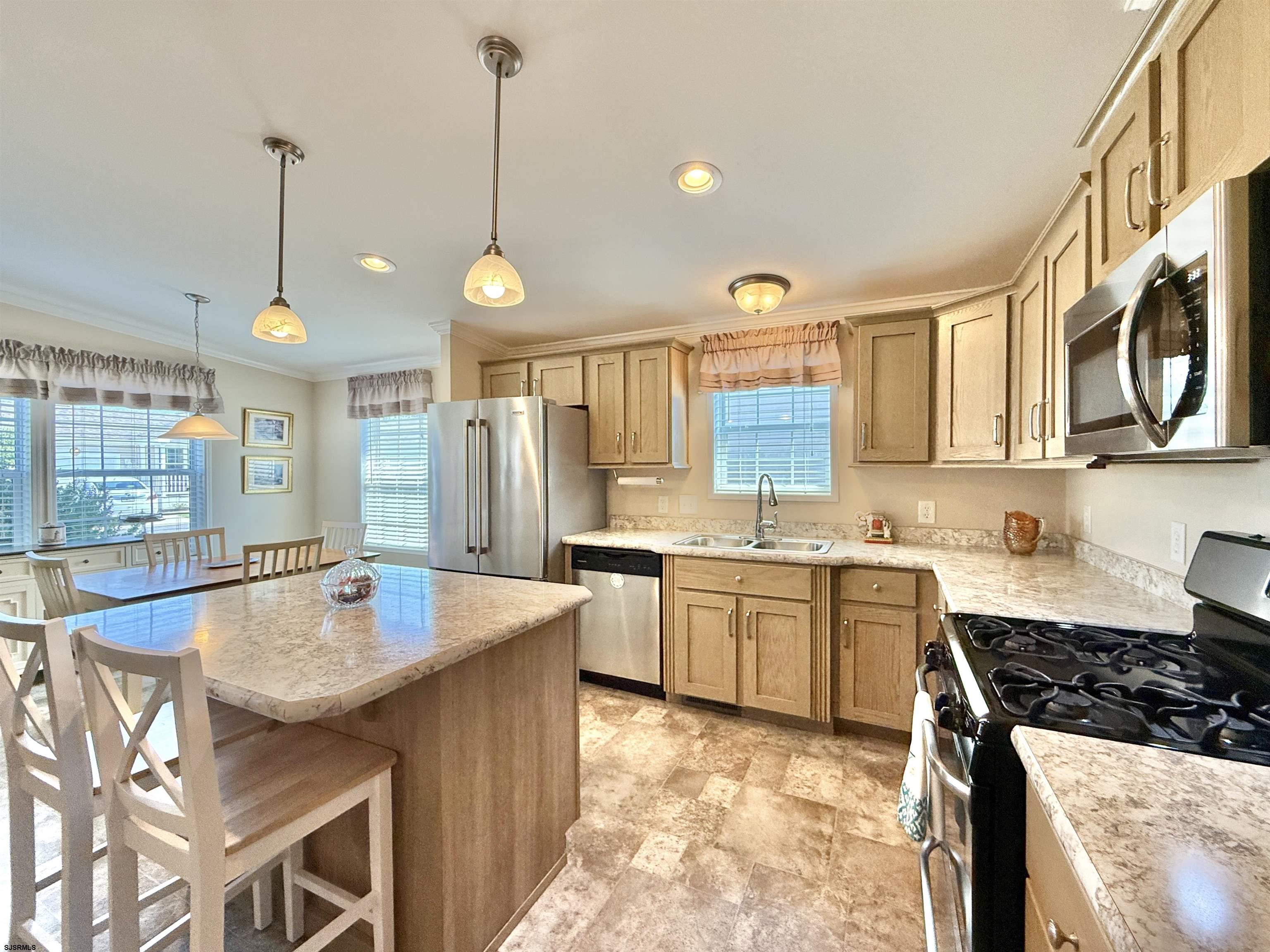2058 South Shore Rd (route 9) Ocean View, NJ 08230 - Photo 22 of 36 a kitchen with stainless steel appliances granite countertop a stove a sink and a refrigerator