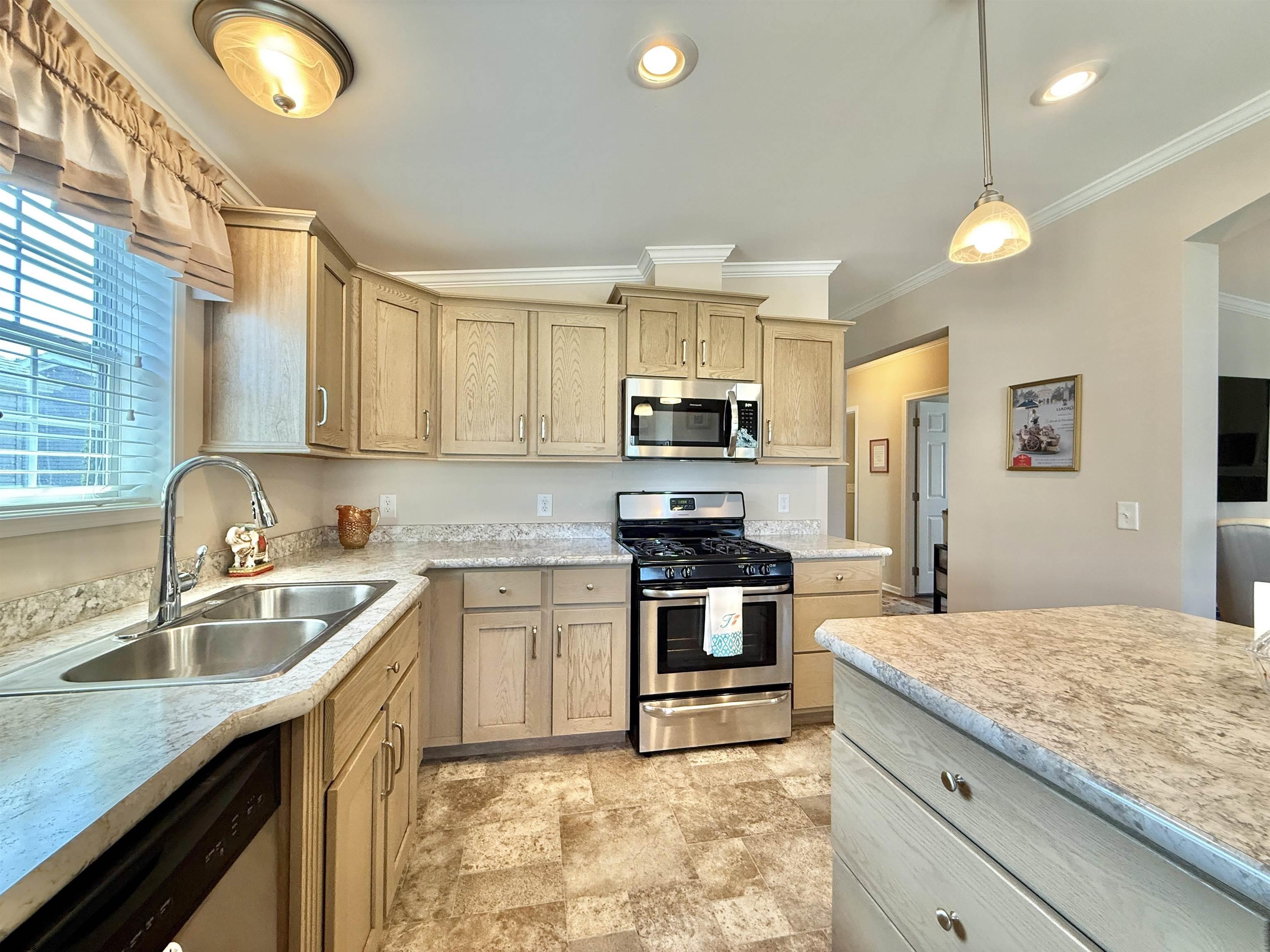 2058 South Shore Rd (route 9) Ocean View, NJ 08230 - Photo 23 of 36 a kitchen with stainless steel appliances granite countertop a sink stove and refrigerator