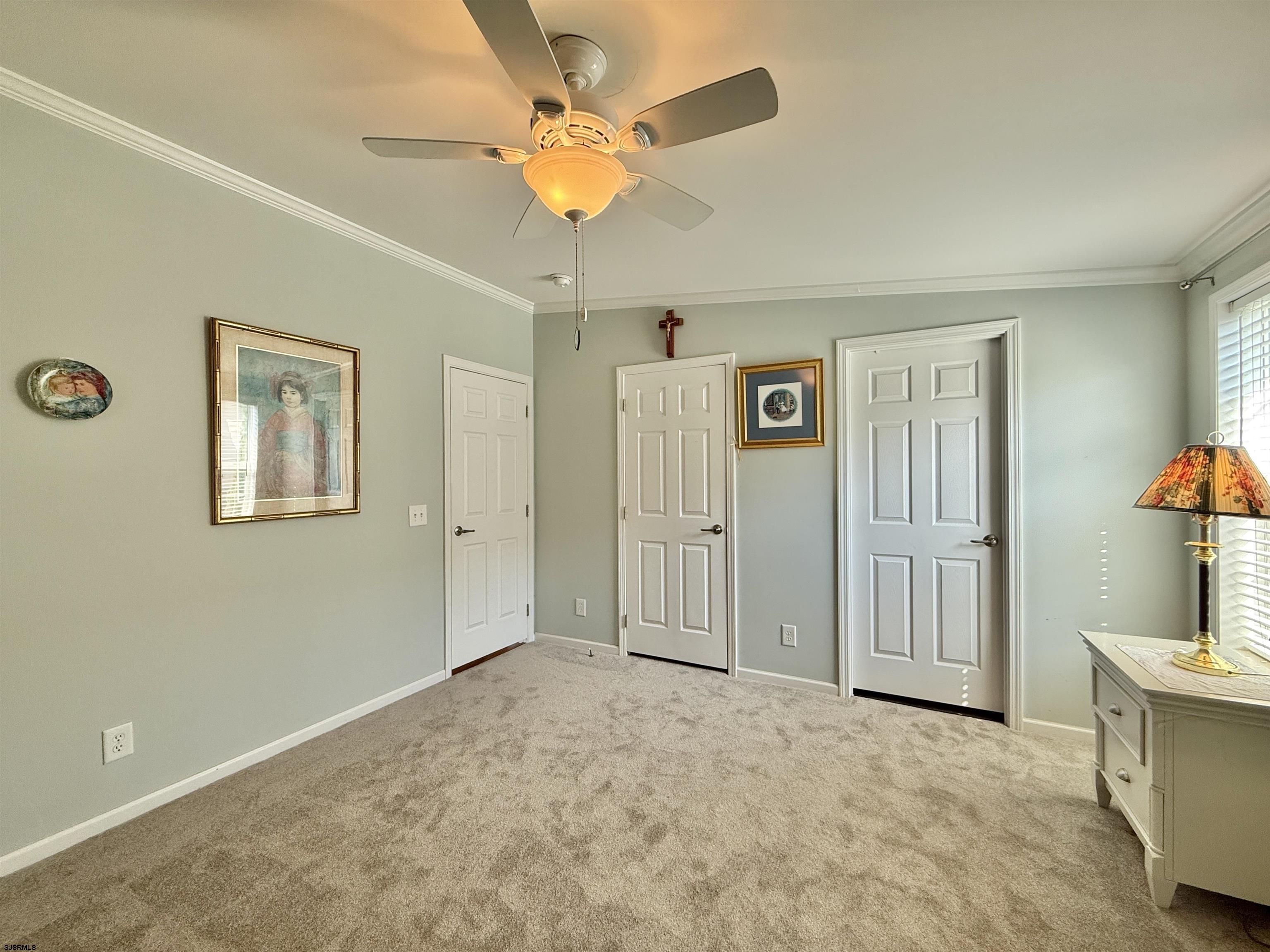 2058 South Shore Rd (route 9) Ocean View, NJ 08230 - Photo 32 of 36 a view of a livingroom with a chandelier fan and windows