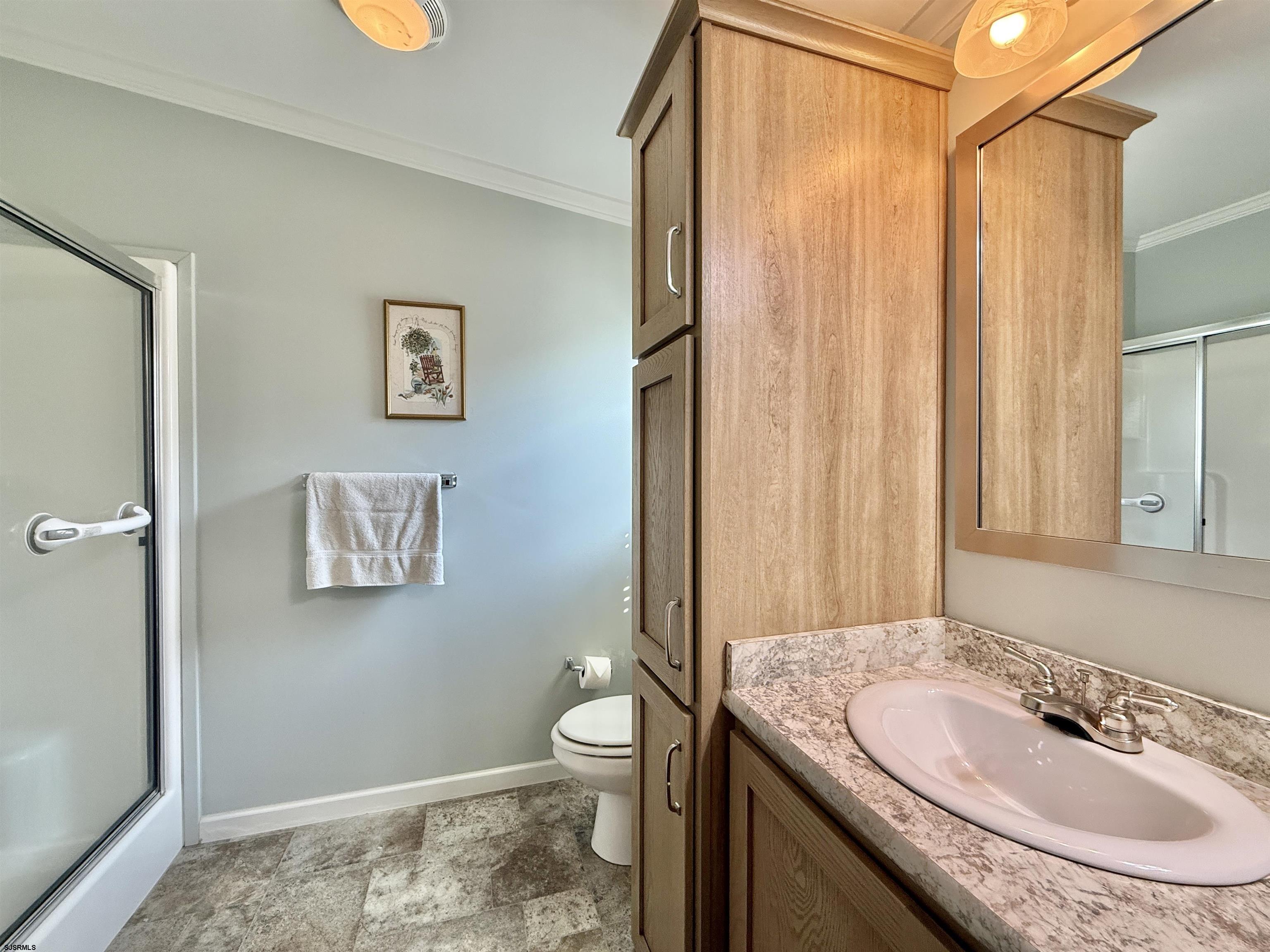 2058 South Shore Rd (route 9) Ocean View, NJ 08230 - Photo 33 of 36 a bathroom with a granite countertop sink toilet and shower