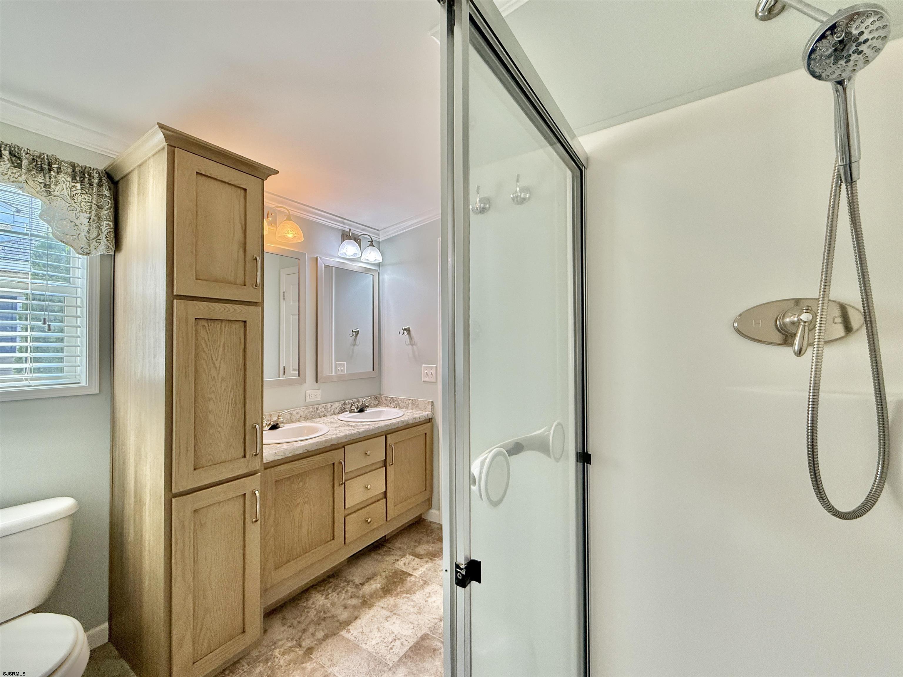 2058 South Shore Rd (route 9) Ocean View, NJ 08230 - Photo 34 of 36 a bathroom with a sink a toilet and shower