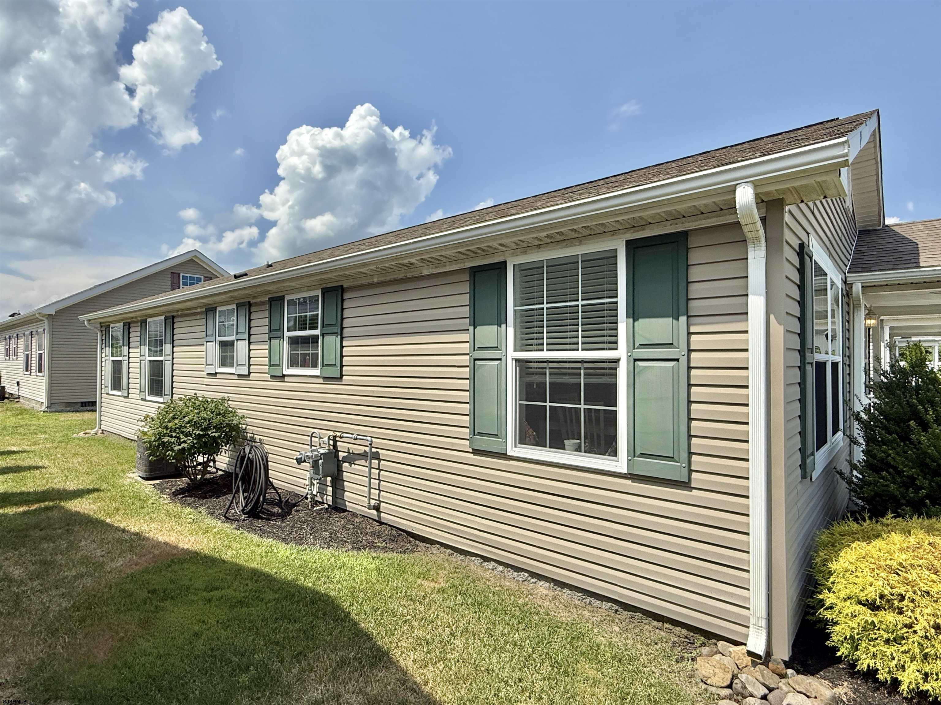 2058 South Shore Rd (route 9) Ocean View, NJ 08230 - Photo 8 of 36 a front view of a house with garden