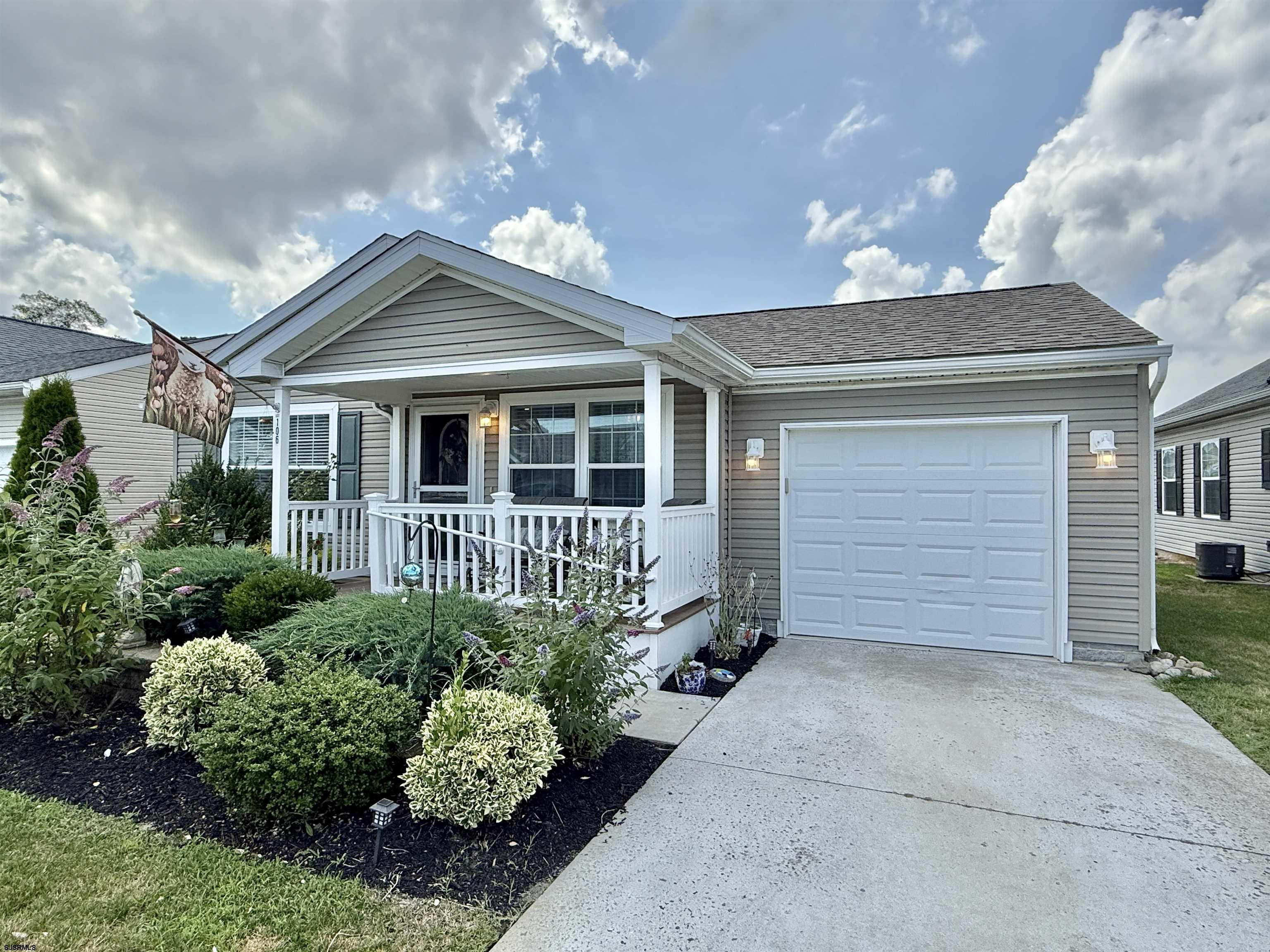 2058 South Shore Rd (route 9) Ocean View, NJ 08230 - Photo 9 of 36 a front view of a house with a garden