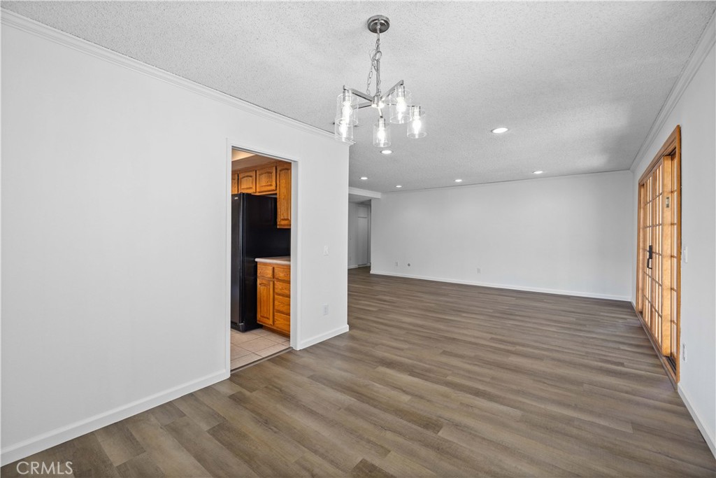 26562 Cardwick Court Newhall, CA 91321 - Photo 12 of 34 a view of a room with wooden floor and natural light