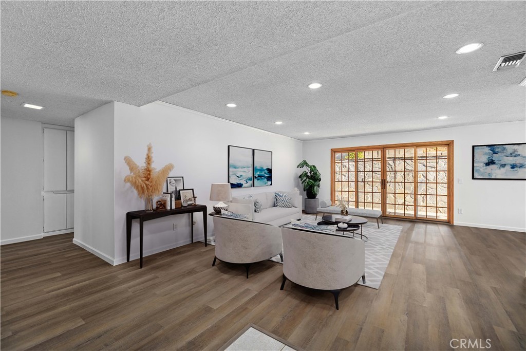 26562 Cardwick Court Newhall, CA 91321 - Photo 2 of 34 a living room with furniture and a wooden floor