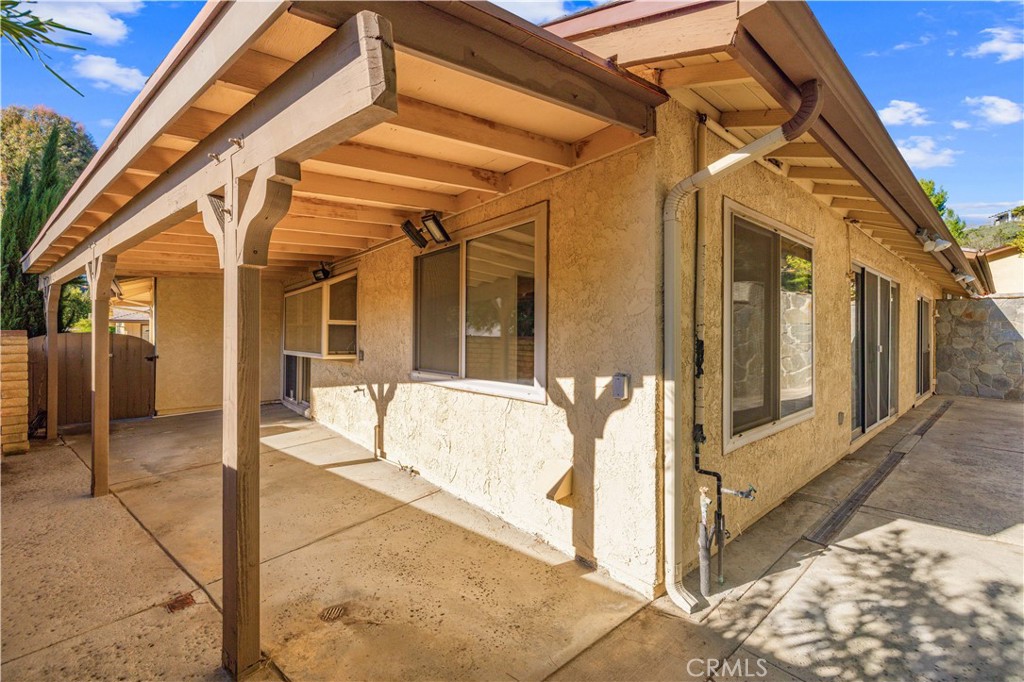 26562 Cardwick Court Newhall, CA 91321 - Photo 23 of 34 a view of a porch with a table and chairs