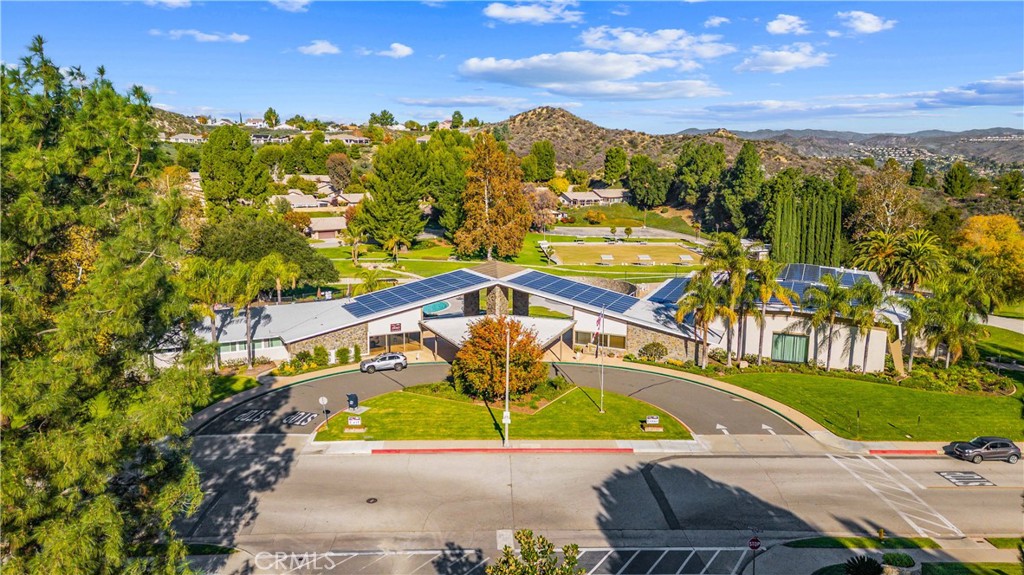 26562 Cardwick Court Newhall, CA 91321 - Photo 29 of 34 a view of a swimming pool with a table and chairs