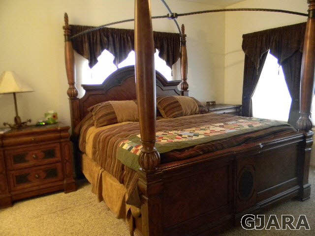 1712 North 3/10 Road Fruita, CO 81521 - Photo 16 of 34 a bedroom with a bed and a window