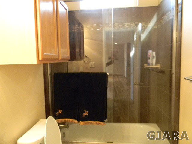 1712 North 3/10 Road Fruita, CO 81521 - Photo 20 of 34 a bathroom with a sink and a mirror
