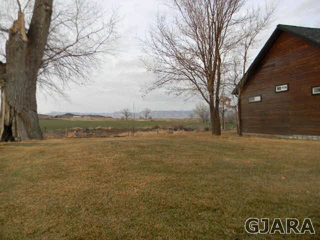 1712 North 3/10 Road Fruita, CO 81521 - Photo 22 of 34 a view of lake with outdoor space