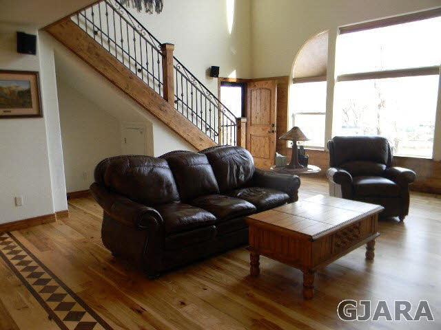 1712 North 3/10 Road Fruita, CO 81521 - Photo 3 of 34 a living room with furniture and a window