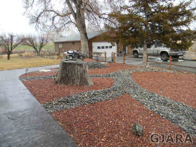1712 North 3/10 Road Fruita, CO 81521 - Photo 32 of 34 a view of a yard with trees