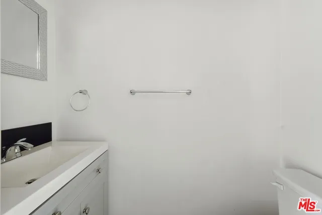 a bathroom with a sink and vanity