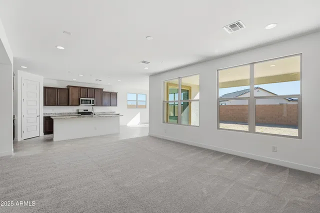 a view of kitchen with stainless steel appliances refrigerator oven and microwave